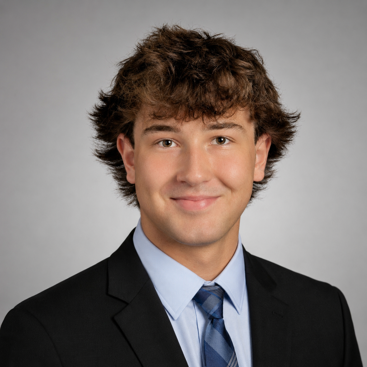 Ahren Becker in a suit and tie